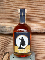 An image of Arthur, a sweet traditional mead in the Excalibur Film collection. The bottle is photographed against a wooden background 